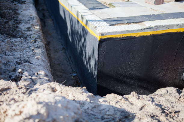 Professional Waterproofing technician working in Springfield, MI